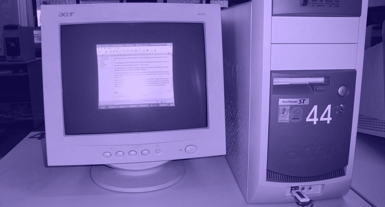 A beige desktop computer and CRT monitor of the late 1990s